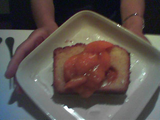 snapshot: fruit on top of what looks like a slice of pound cake