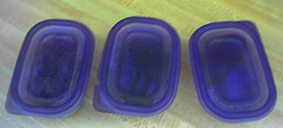 three plastic containers