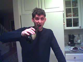 me taking a big pull on a champagne bottle