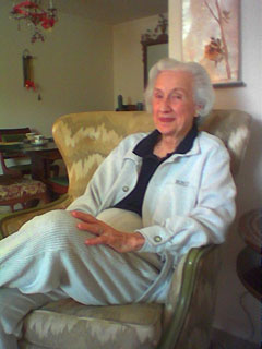 my grandmother in a chair, smirking