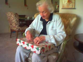 my grandmother opening a gift